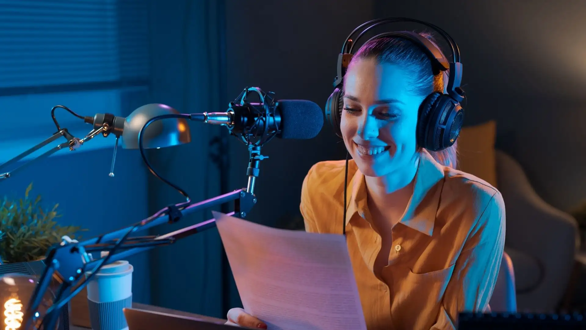 Internet radio broadcaster presenting at a microphone